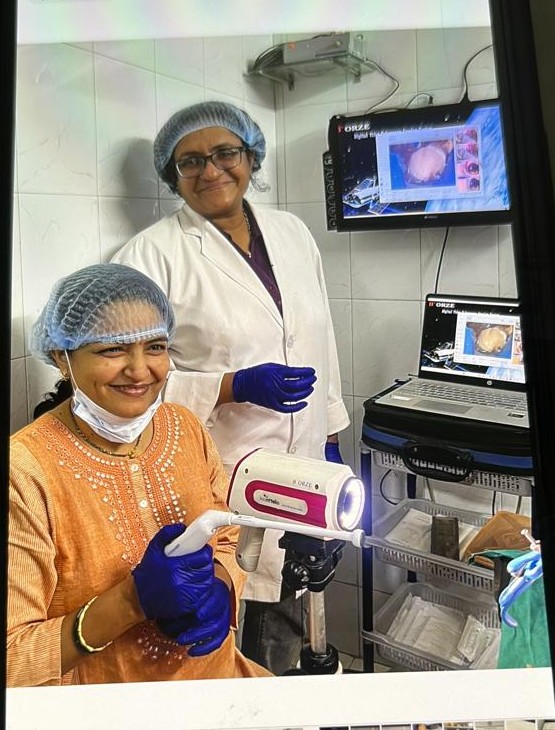 Dr. Anjjalee Reddy performing hands-on digital colposcopy during training